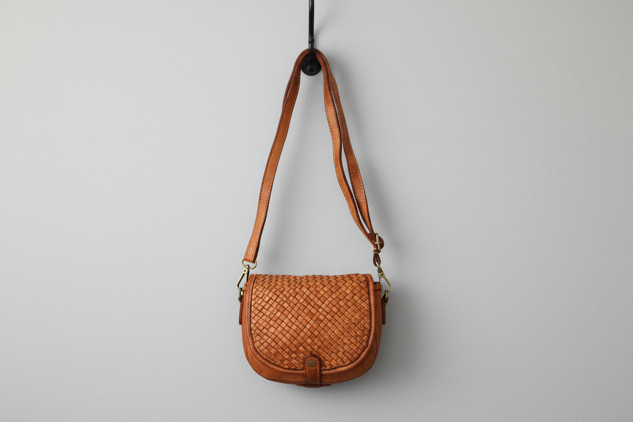 Brown woven leather handbag with a strap 