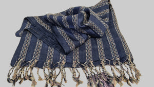Blue striped scarf with fringes on a beige background