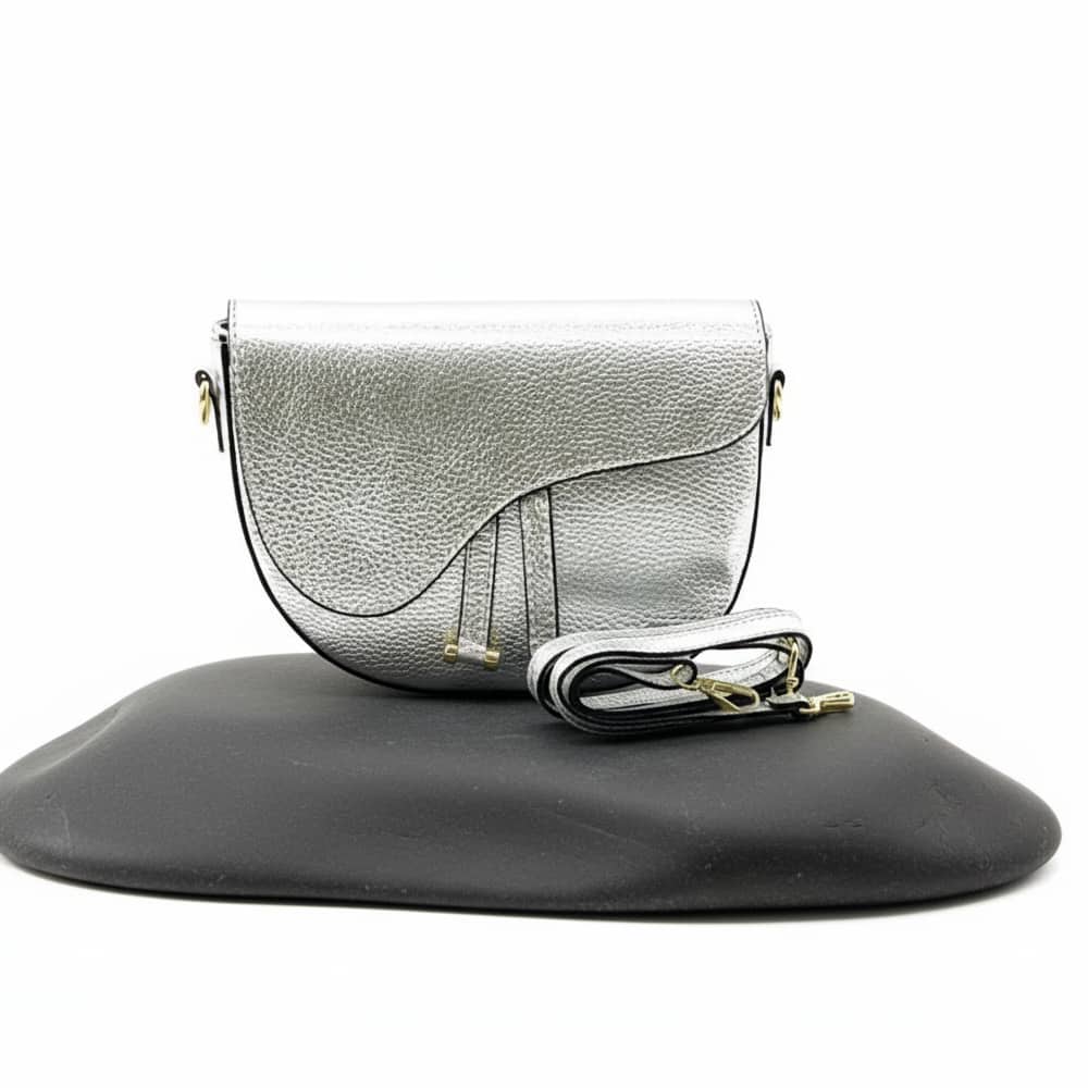 Silver handbag with gold accents on a white background